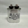 A cylindrical metal capacitor labeled CBB65-370V755-M2 with two terminals on top, displaying technical specifications such as 7.5 μF and 370 VAC on its front.