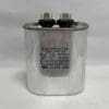 A silver CBB65-440V156 15 μF 440 VAC capacitor from Wuxi-Motor features two connectors on top. Its label displays specifications such as 15 μF, 440 VAC, temperature and frequency ranges, along with the RoHS mark and additional certifications.