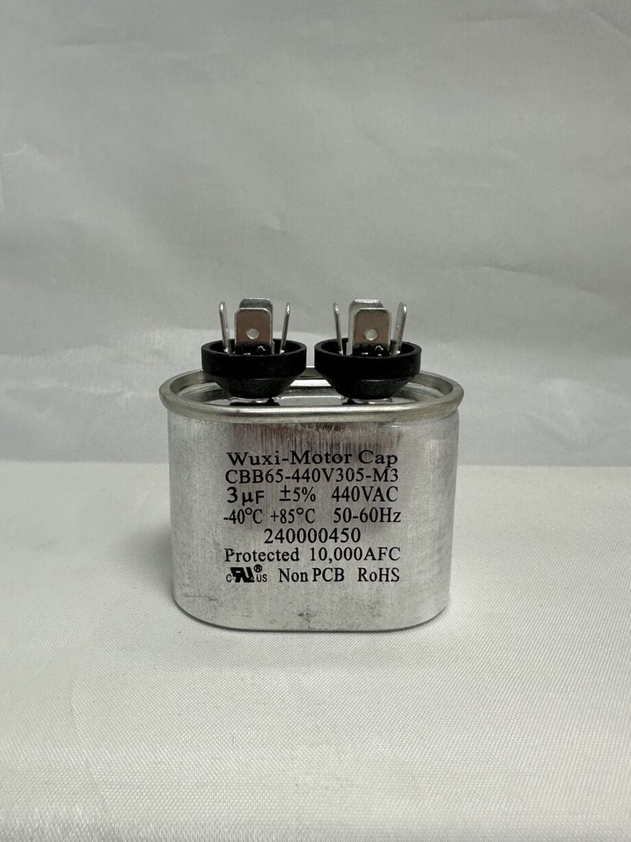 A silver cylindrical CBB65-440V305-M3 3 uF 440 VAC Capacitor (model 12027 A-8203-3.0), labeled Wuxi Motor Cap, features two terminals on top along with specifications such as 3μF, 440VAC, 50/60Hz, temperature ratings, and various certification marks against a plain background.