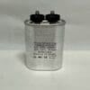 A CBB65E-450V405 4.0 uF 450 VAC Capacitor (model 620057820) in silver, featuring two black terminals on top and labeled 4µF ±5%, 450VAC, 40°C to 70°C, 50/60Hz, protected to 10,000AFC, is placed on a plain white surface.