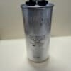 CBB65-250R1275R-M8 125 uF 250 VAC capacitor, a cylindrical metal unit with two electrical terminals at the top and technical specifications printed on the side.