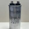 A CBB65-440R406R-M3 40 uF 440 VAC Fuel Pump Capacitor with internal resistor, labeled "Wuxi Motor Cap," featuring two top terminals, shown upright on a white surface.