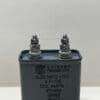 A gray rectangular High Voltage Capacitor 0.25 uF 4000 VDC (P/N 4675) from Chicago Condenser Corp with two metal terminals on top, RoHS compliant, labeled as NON-PCB OIL and ±10% tolerance.