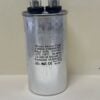 A cylindrical metal capacitor with two top terminals, labeled HEAVY-DUTY Coleman 1499-5761 60 MFD 370 VAC Run Capacitor (606-M3), for RV air conditioners, featuring technical specs and safety certifications.